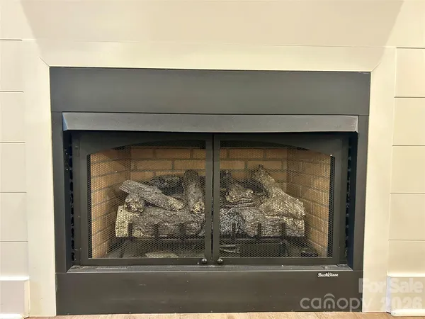 a bathroom with a granite countertop sink and white cabinets
