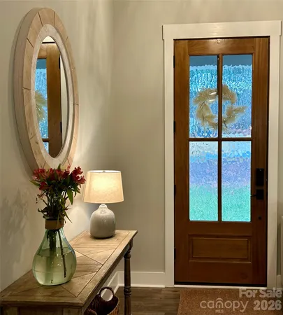 a kitchen with kitchen island a table and chairs in it