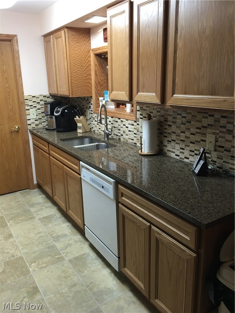 8985 Priem Road Strongsville, OH 44149 - Photo 6 of 25 Kitchen updated in 2013 features quartz countertops & glass tile back splash