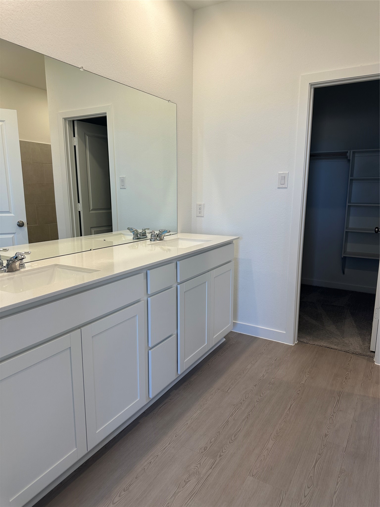 3124 Ruby Ridge Drive Katy, TX 77493 - Photo 3 of 12 a bathroom with a double vanity sink and mirror