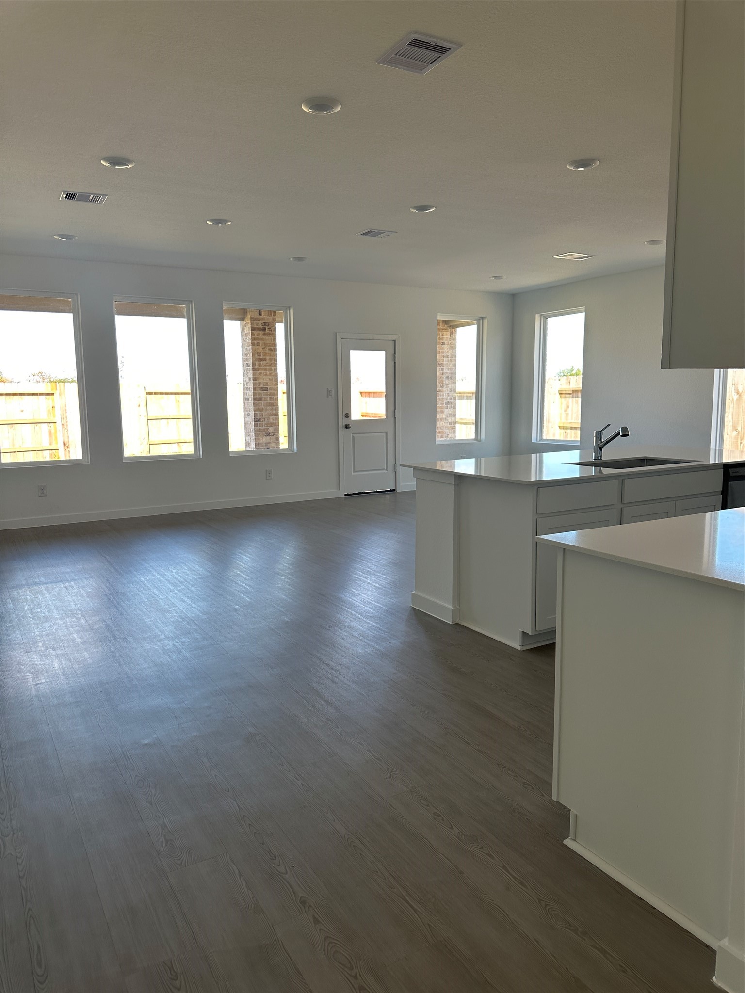 3124 Ruby Ridge Drive Katy, TX 77493 - Photo 4 of 12 an empty room with wooden floor and windows