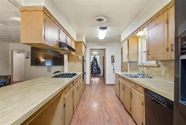 a bathroom with a shower and a sink