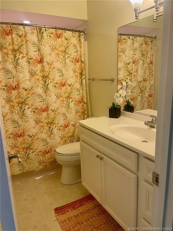 1225 Northwest 21st Street, Unit 3014 Stuart, FL 34994 - Photo 16 of 37 a bathroom with a sink and a toilet
