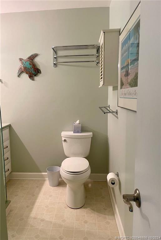 1225 Northwest 21st Street, Unit 3014 Stuart, FL 34994 - Photo 20 of 37 a bathroom with a toilet and a shower