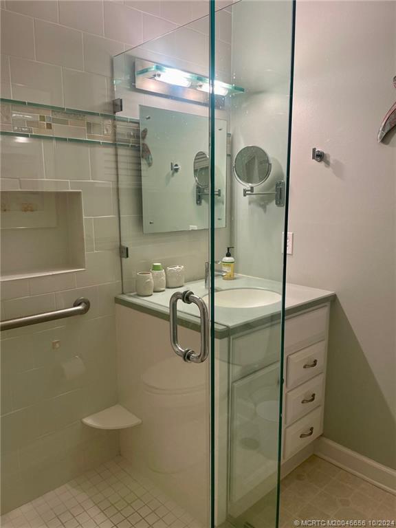 1225 Northwest 21st Street, Unit 3014 Stuart, FL 34994 - Photo 21 of 37 a bathroom with a shower and a toilet
