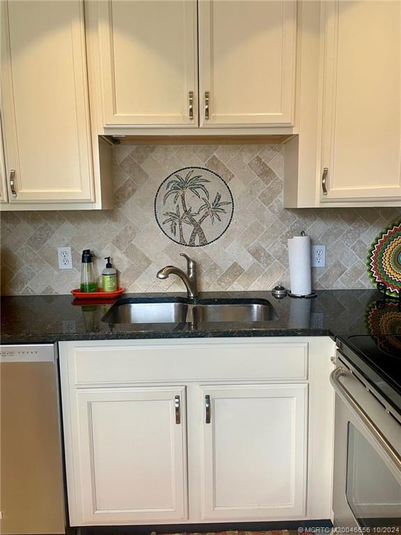 1225 Northwest 21st Street, Unit 3014 Stuart, FL 34994 - Photo 10 of 37 a kitchen with a sink and cabinets