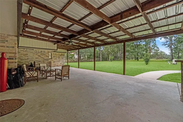 a view of a yard with porch and furniture