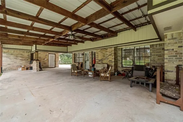 a living room with furniture a clock and a table