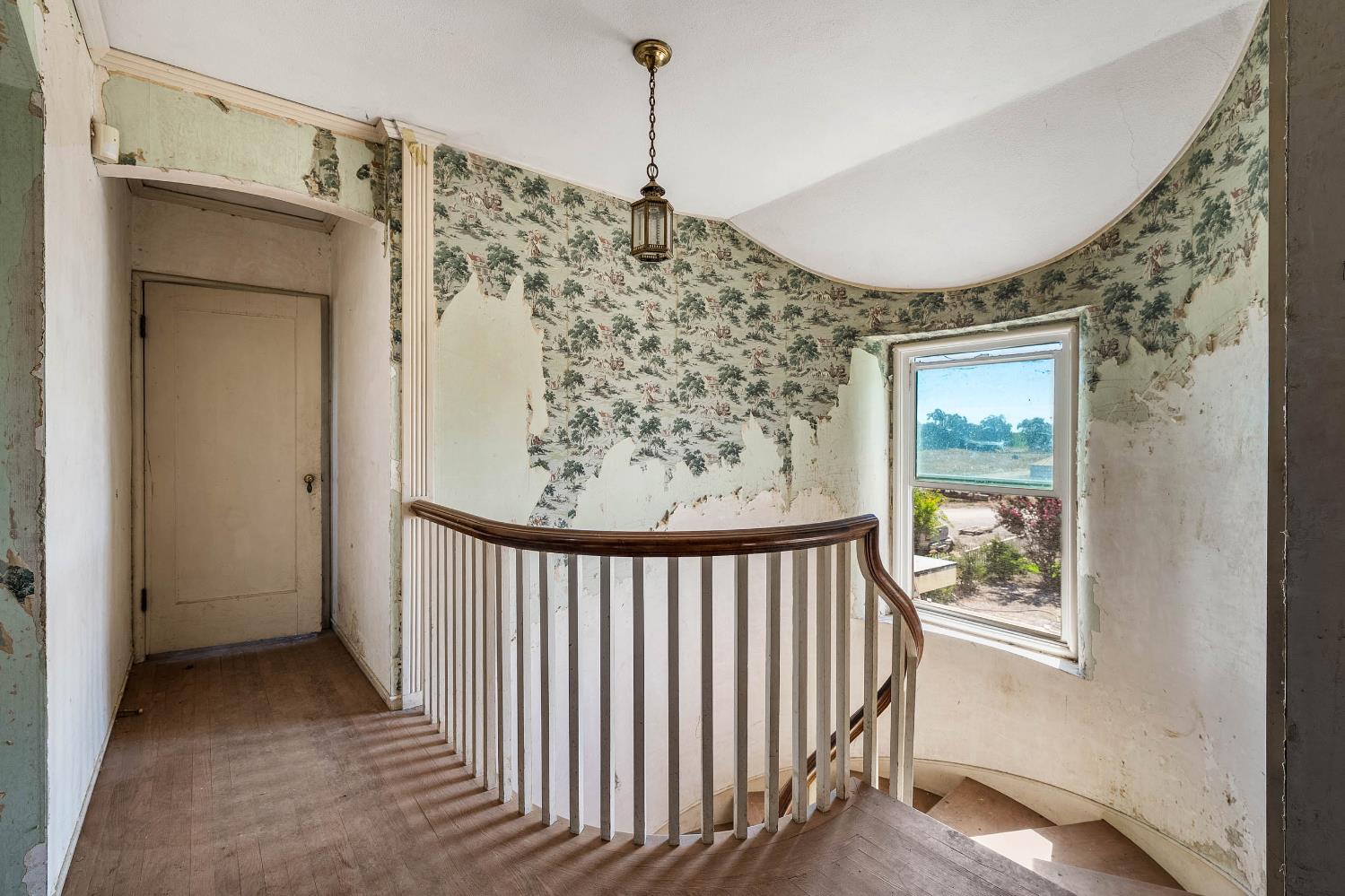 743 College City Road Arbuckle, CA 95912 - Photo 16 of 61 a view of a hallway to a bedroom and a window