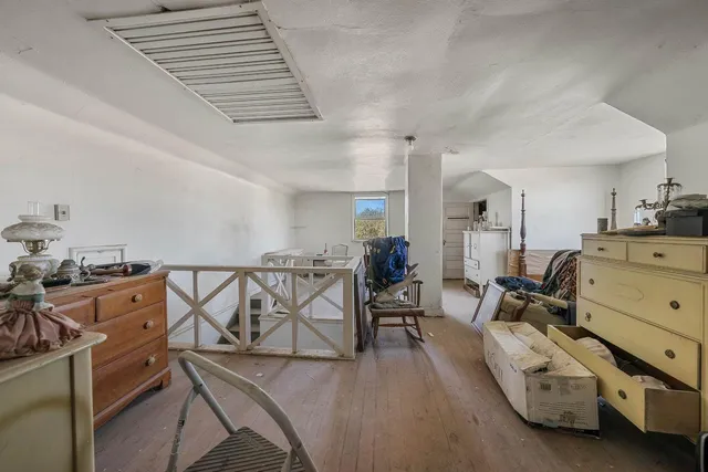 a view of a livingroom with furniture and window