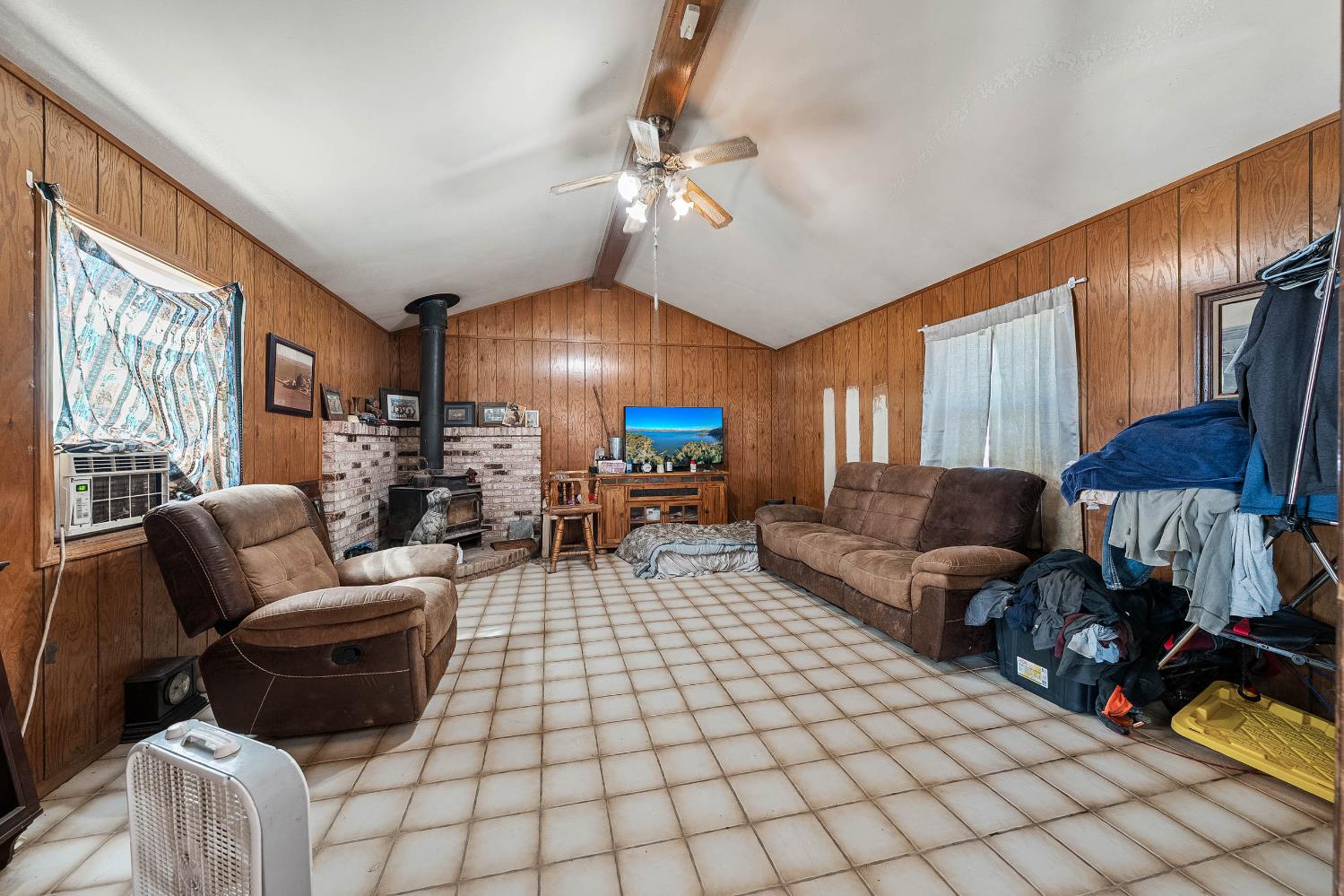 743 College City Road Arbuckle, CA 95912 - Photo 24 of 61 a living room with furniture and a chandelier