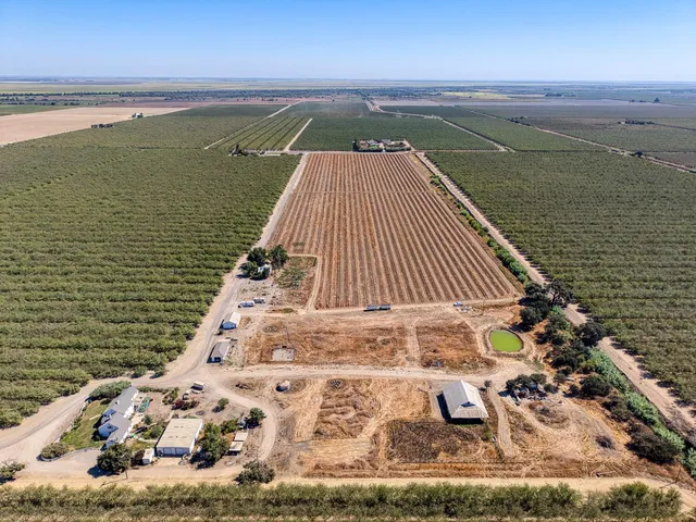 a view of a house with a yard and garage