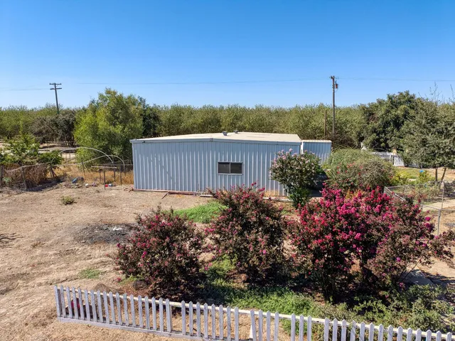 a house with a wooden fence