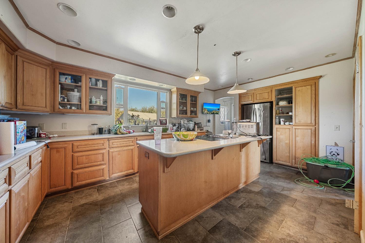 743 College City Road Arbuckle, CA 95912 - Photo 6 of 61 a large kitchen with stainless steel appliances kitchen island granite countertop a sink and cabinets