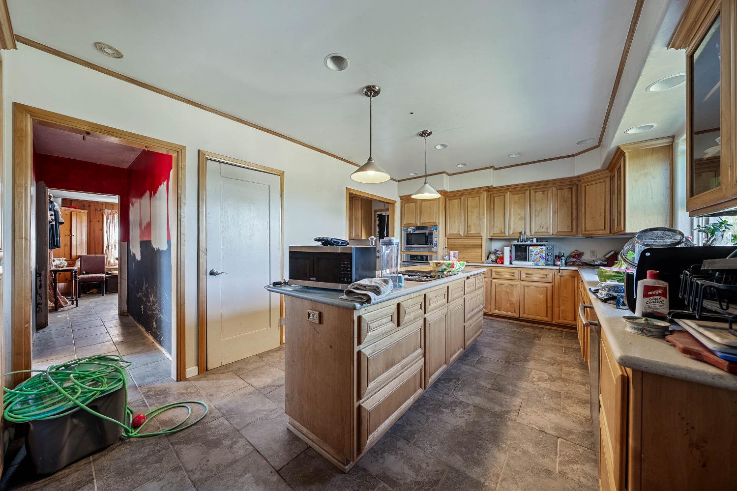 743 College City Road Arbuckle, CA 95912 - Photo 8 of 61 a kitchen with stainless steel appliances granite countertop a stove top oven a sink a refrigerator and white cabinets