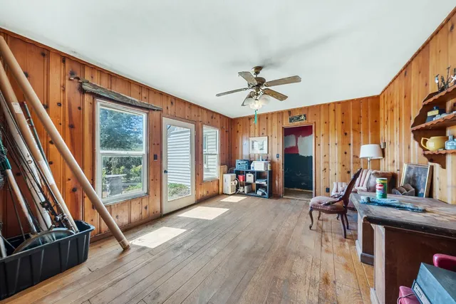 a view of livingroom with furniture wooden floor and windows