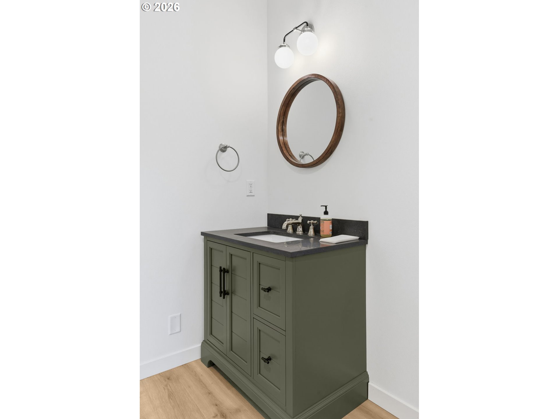 5592 Burnett Avenue, Unit B Eugene, OR 97402 - Photo 18 of 36 a bathroom with a sink and a mirror