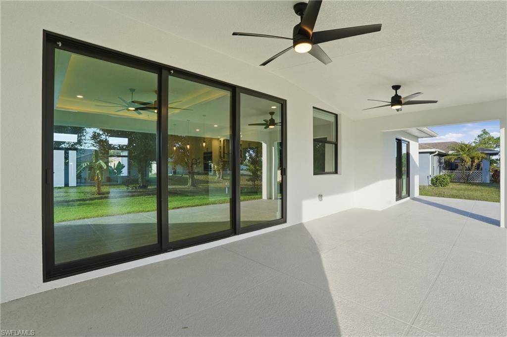 3903 15th Street Southwest Lehigh Acres, FL 33976 - Photo 34 of 44 a view of a porch with furniture and front door