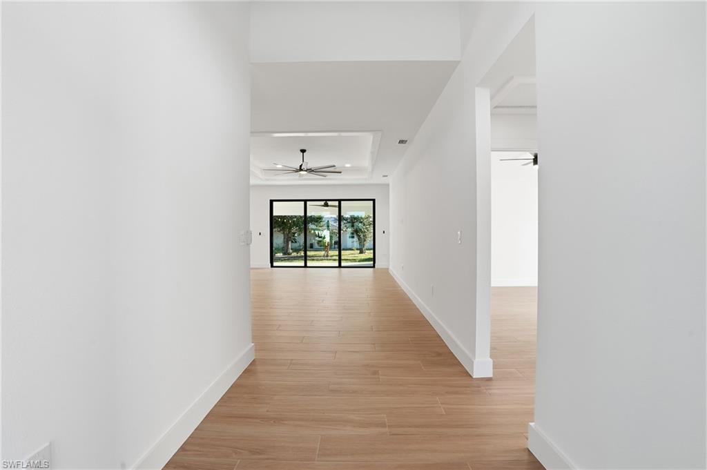 3903 15th Street Southwest Lehigh Acres, FL 33976 - Photo 5 of 44 a view of hallway with wooden floor