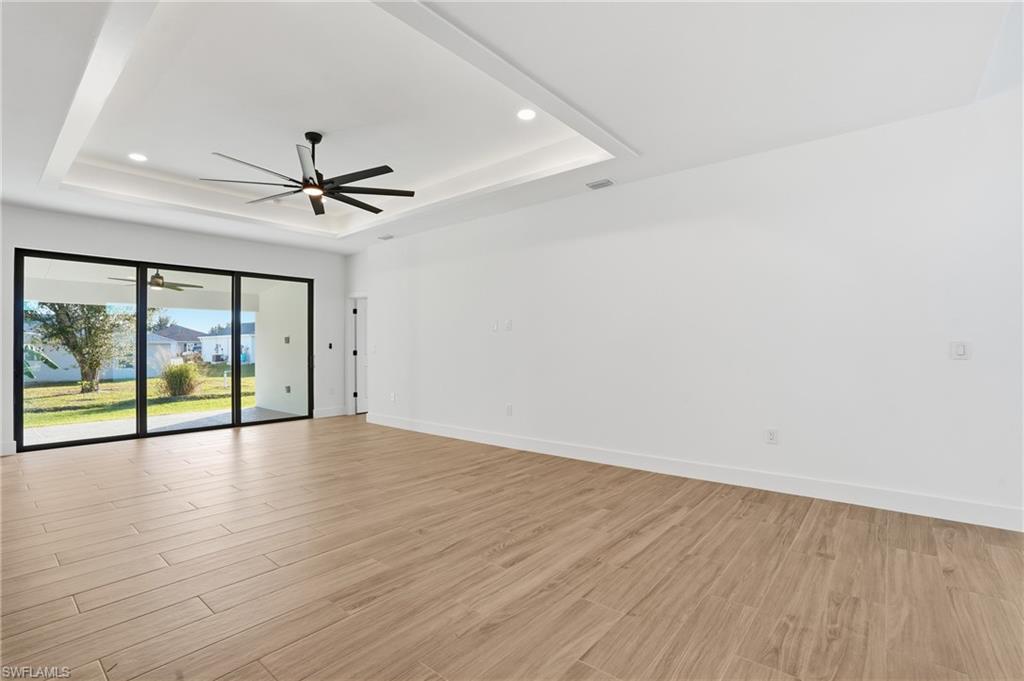 3903 15th Street Southwest Lehigh Acres, FL 33976 - Photo 9 of 44 a view of an empty room with a window