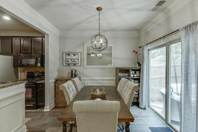 a living room with furniture a chandelier and a chandelier