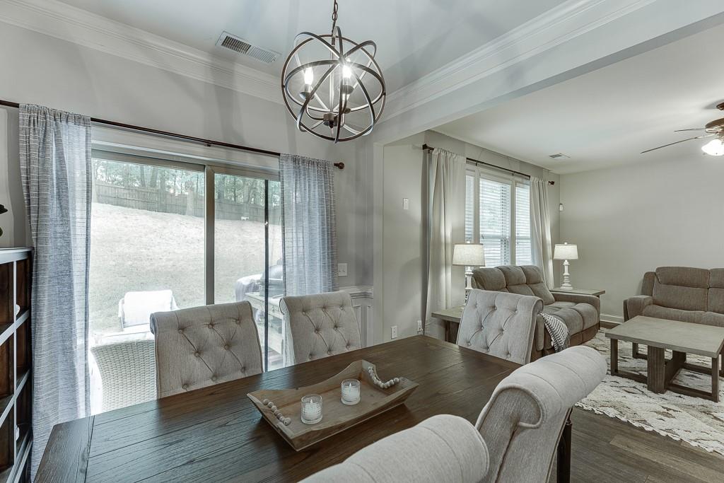 2140 Harvest Ridge Circle Northeast Buford, GA 30519 - Photo 19 of 38 a living room with furniture and wooden floor