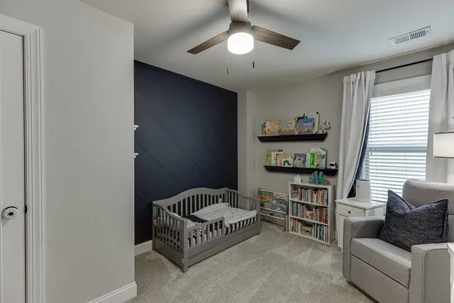 a bedroom with furniture and a window