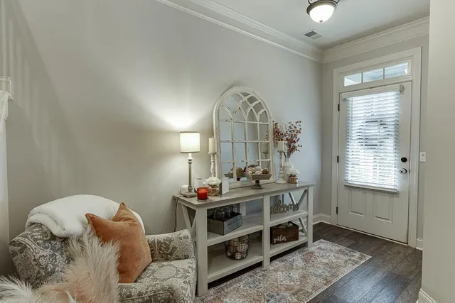 a bedroom with furniture and a window