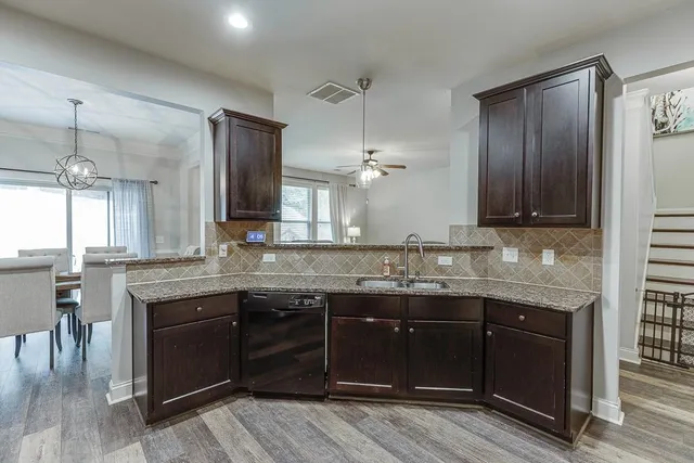 a kitchen with a sink and cabinets