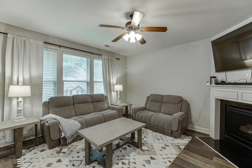 2140 Harvest Ridge Circle Northeast Buford, GA 30519 - Photo 9 of 38 a living room with furniture and a fireplace