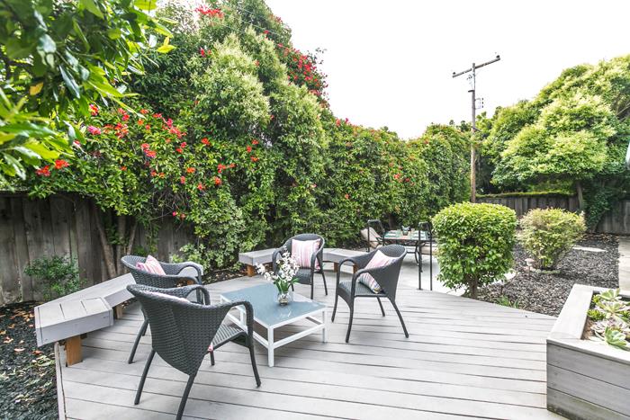 1324 Flicker Way Sunnyvale, CA 94087 - Photo 22 of 33 a view of a patio with table and chairs potted plants with wooden floor and fence
