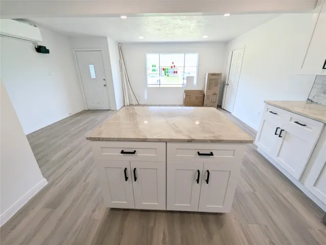 a view of a kitchen counter space with wooden floor