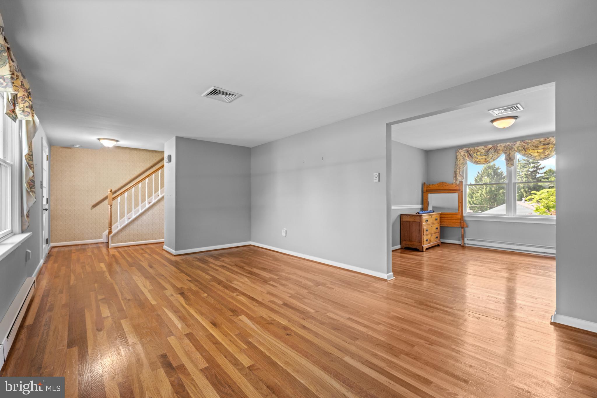 258 Monacy Road Coatesville, PA 19320 - Photo 29 of 54 a view of an empty room with wooden floor and a window