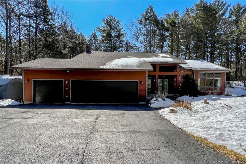 130 Lair Road New Hartford, CT 06057 - Photo 1 of 1 a front view of a house with a yard and garage