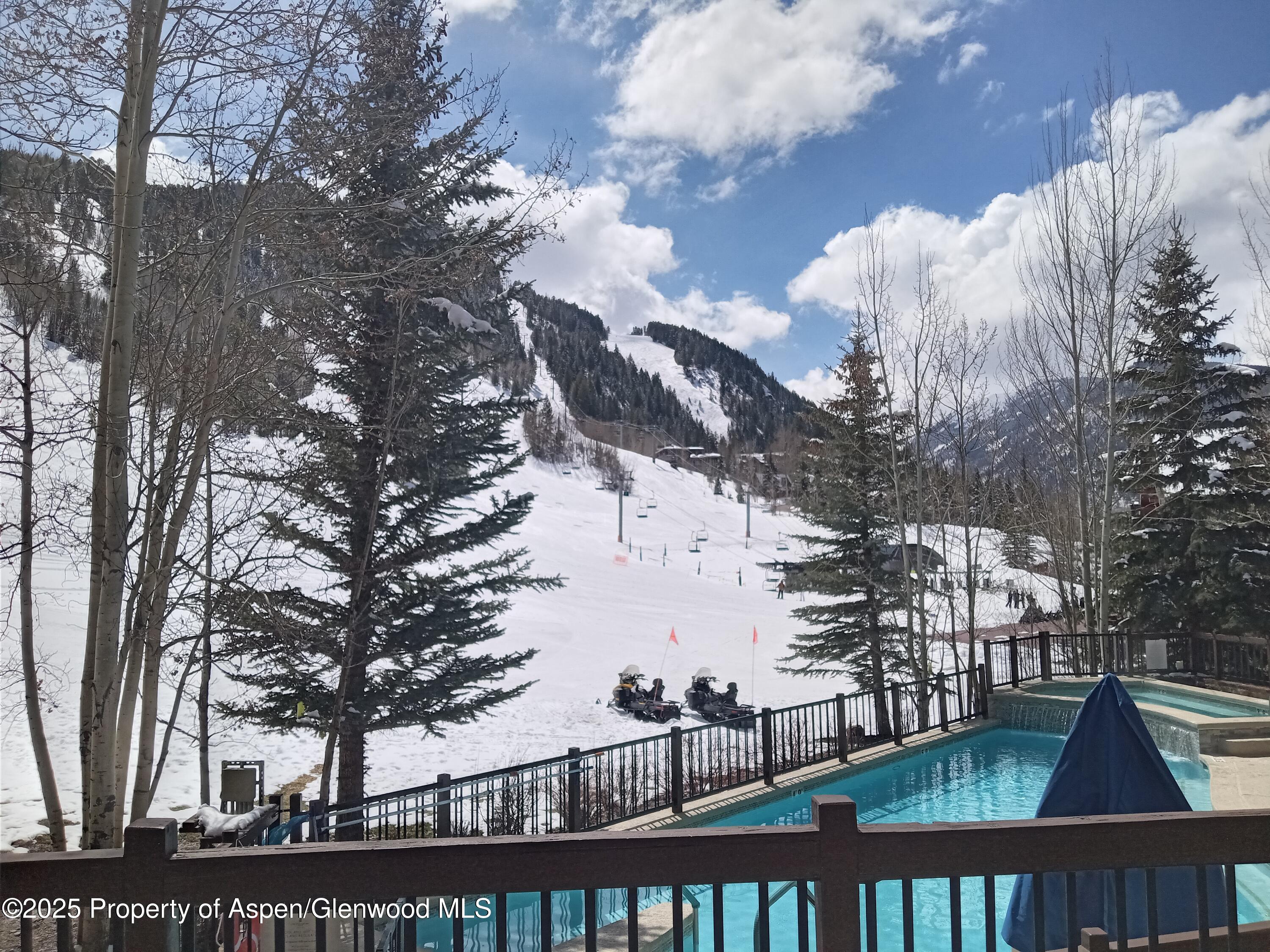 197 Prospector Road, Unit 2405 SUMMER INTEREST 12 Aspen, CO 81611 - Photo 19 of 24 a view of building and outdoor space