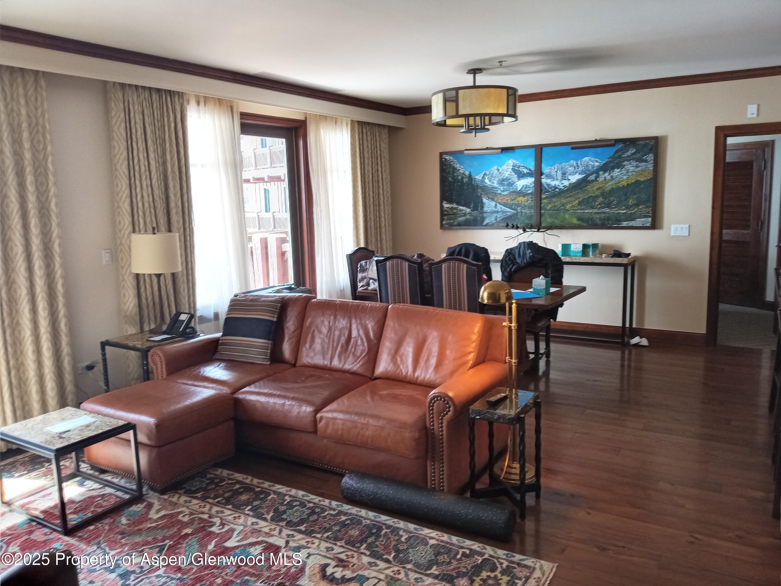 197 Prospector Road, Unit 2405 SUMMER INTEREST 12 Aspen, CO 81611 - Photo 24 of 24 a living room with furniture and a flat screen tv