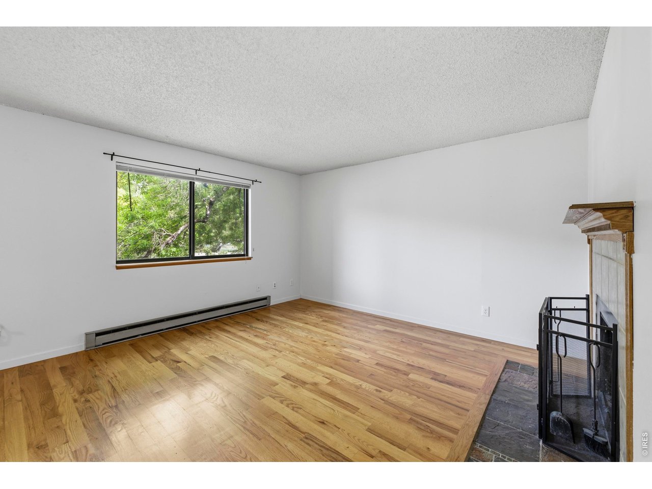 925 Columbia Road, Unit 824 Fort Collins, CO 80525 - Photo 6 of 36 a view of an empty room with a window