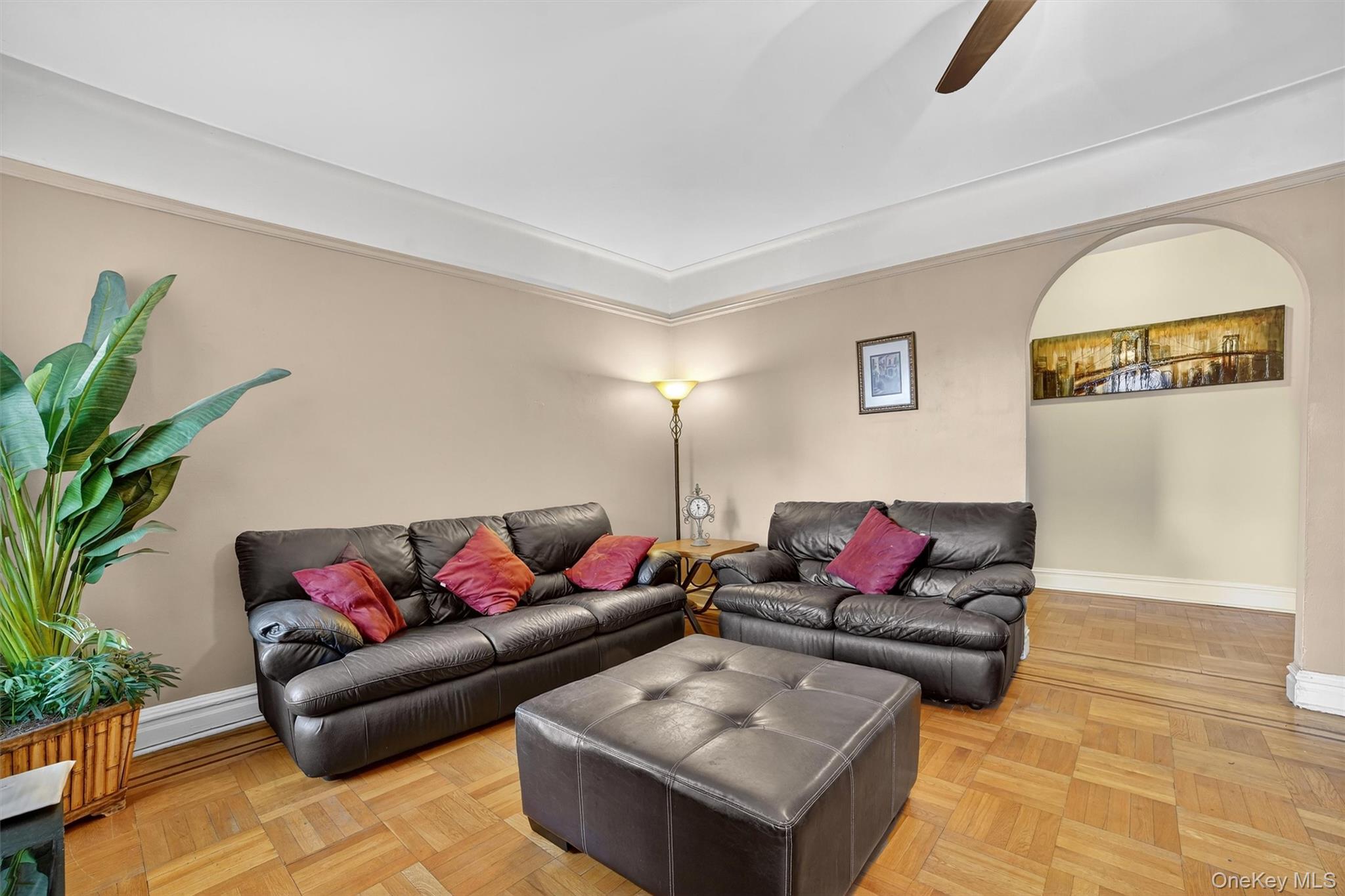 219 Bronx River Road, Unit 2L Yonkers, NY 10704 - Photo 12 of 29 a living room with furniture and a potted plant