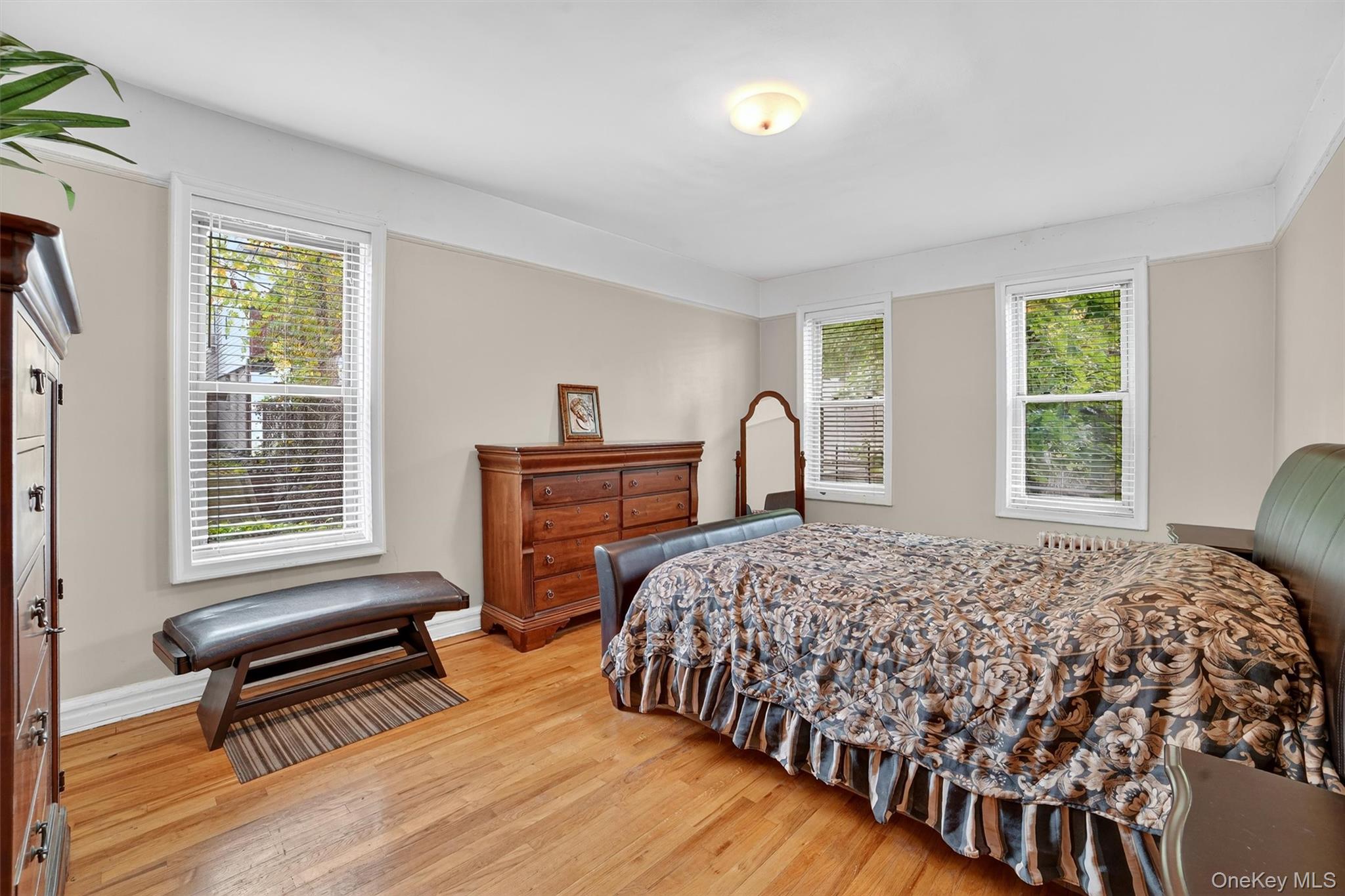 219 Bronx River Road, Unit 2L Yonkers, NY 10704 - Photo 20 of 29 a bedroom with bed and a window