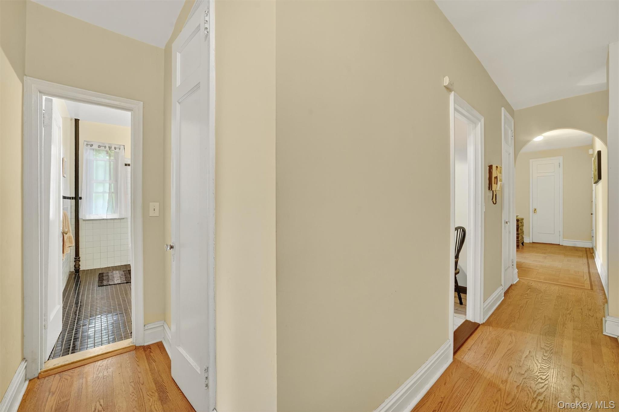 219 Bronx River Road, Unit 2L Yonkers, NY 10704 - Photo 23 of 29 a view of a hallway with a livingroom and a bathroom with sink