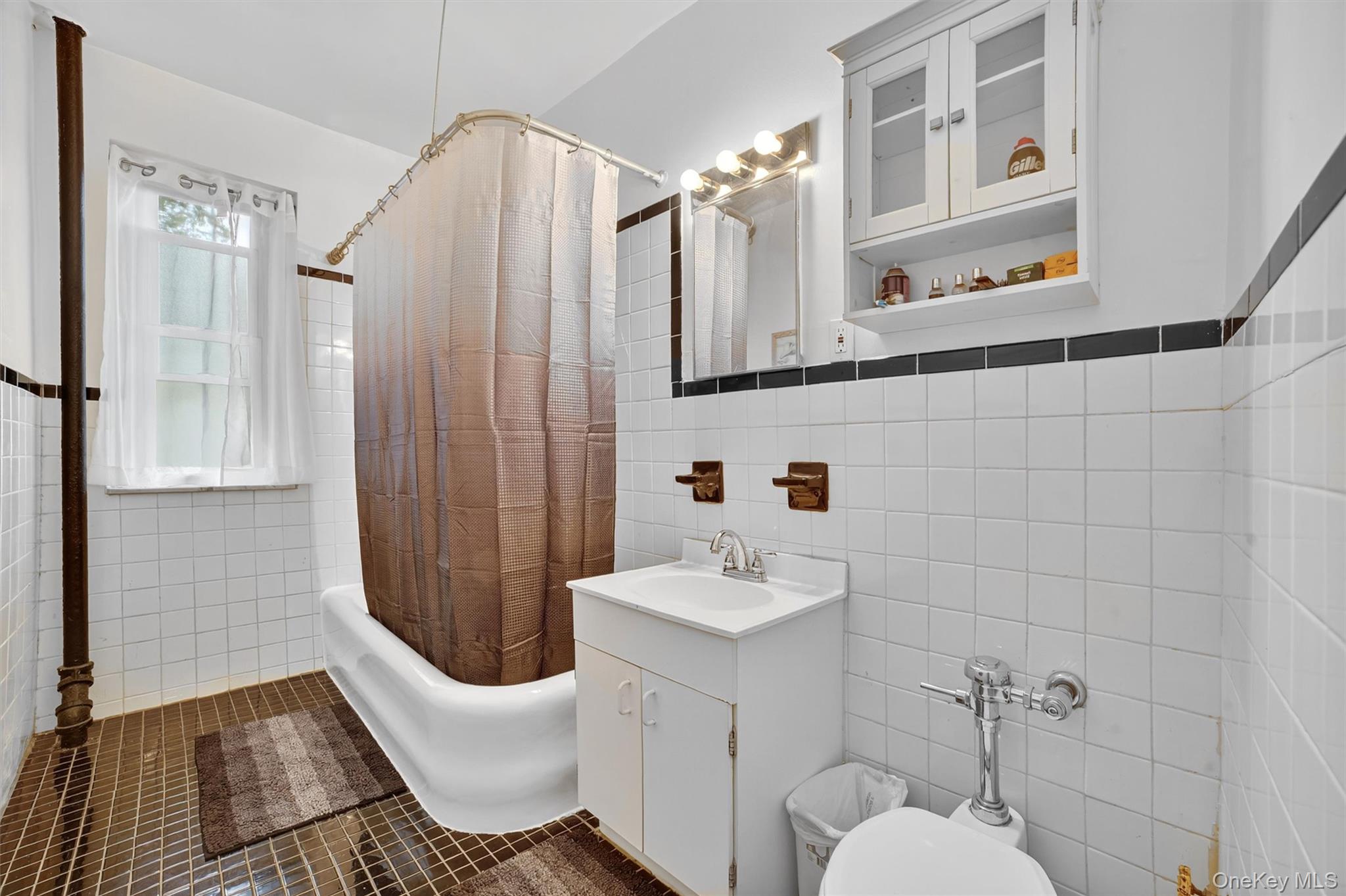 219 Bronx River Road, Unit 2L Yonkers, NY 10704 - Photo 24 of 29 a bathroom with a sink toilet and shower