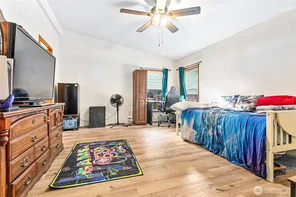 a bedroom with furniture and a chandelier