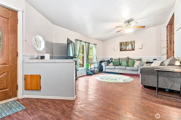 a view of a living room and kitchen