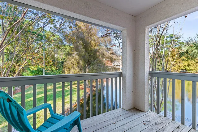 a view of a balcony with wooden floor