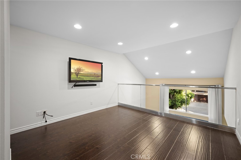 323 North Jackson Street, Unit 119 Glendale, CA 91206 - Photo 16 of 34 a view of empty room with wooden floor and window