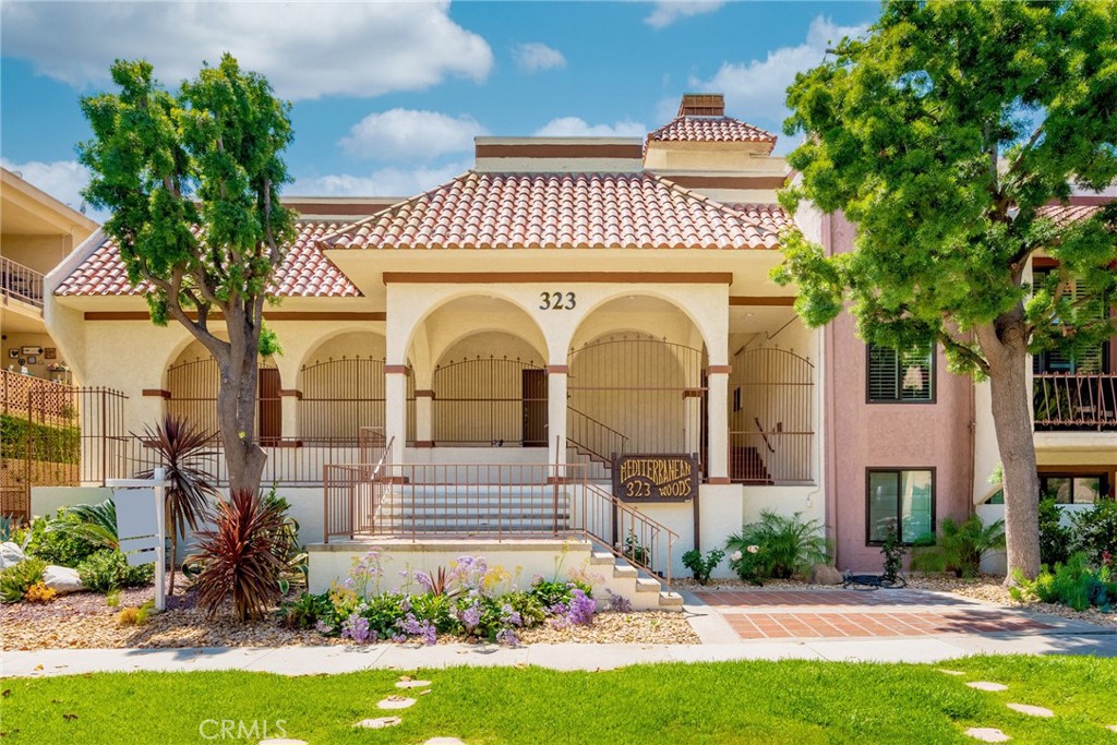 323 North Jackson Street, Unit 119 Glendale, CA 91206 - Photo 2 of 34 a view of a house with a garden