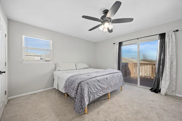 a bedroom with a large bed and a tv