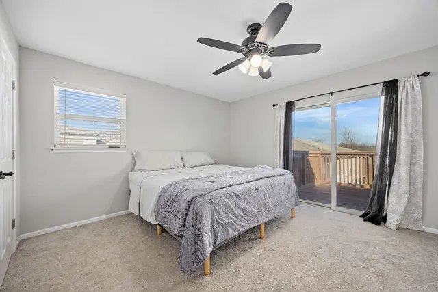 a bedroom with a large bed and a tv