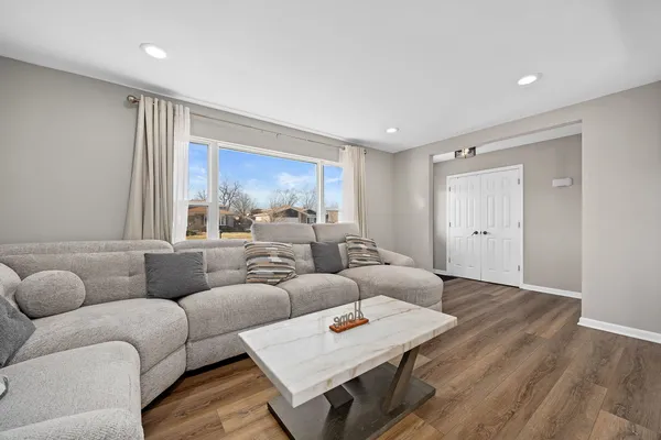 a living room with furniture and a window