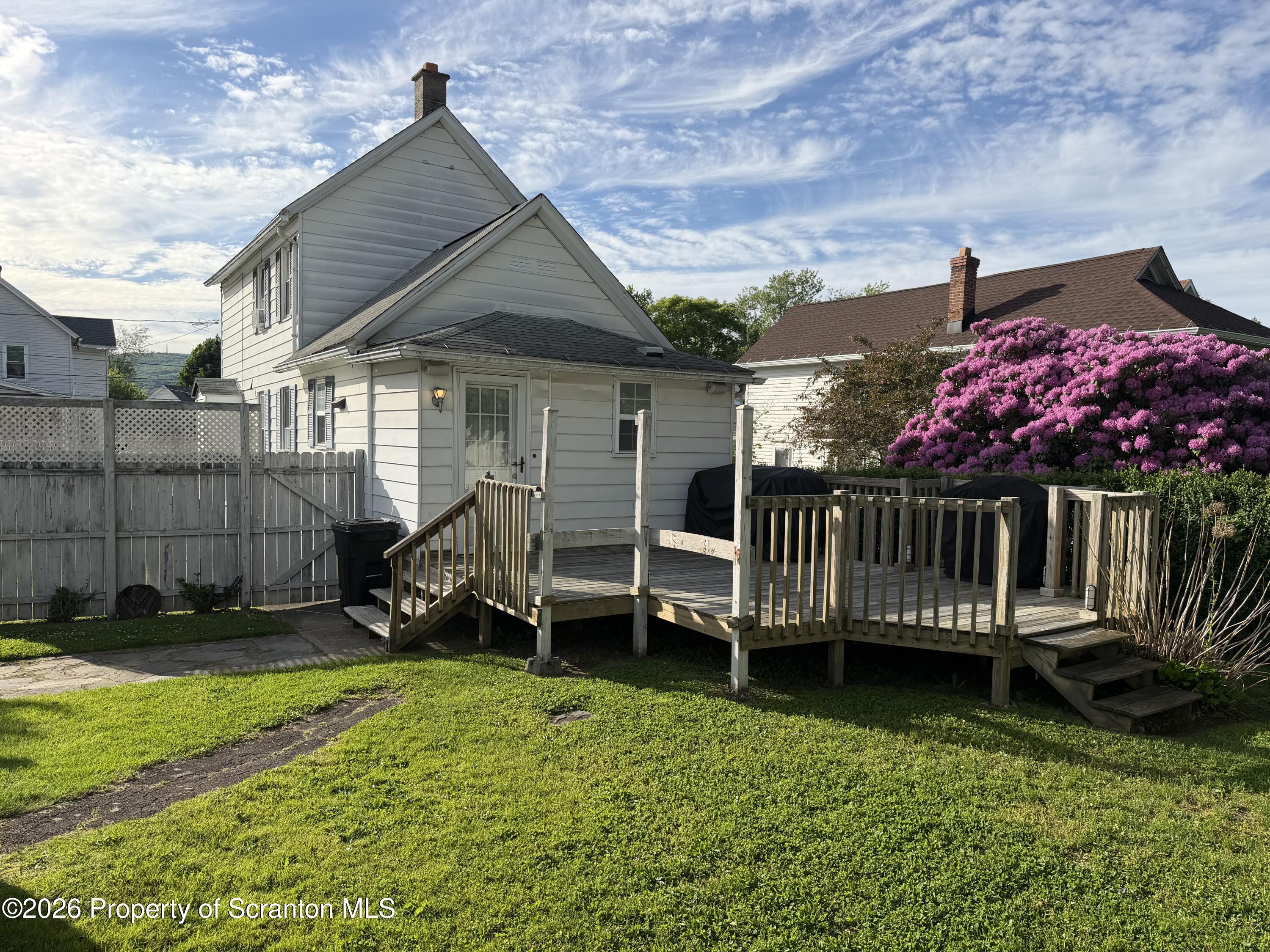320 Haverly Street Throop, PA 18512 - Photo 5 of 27 front view of a house with a yard